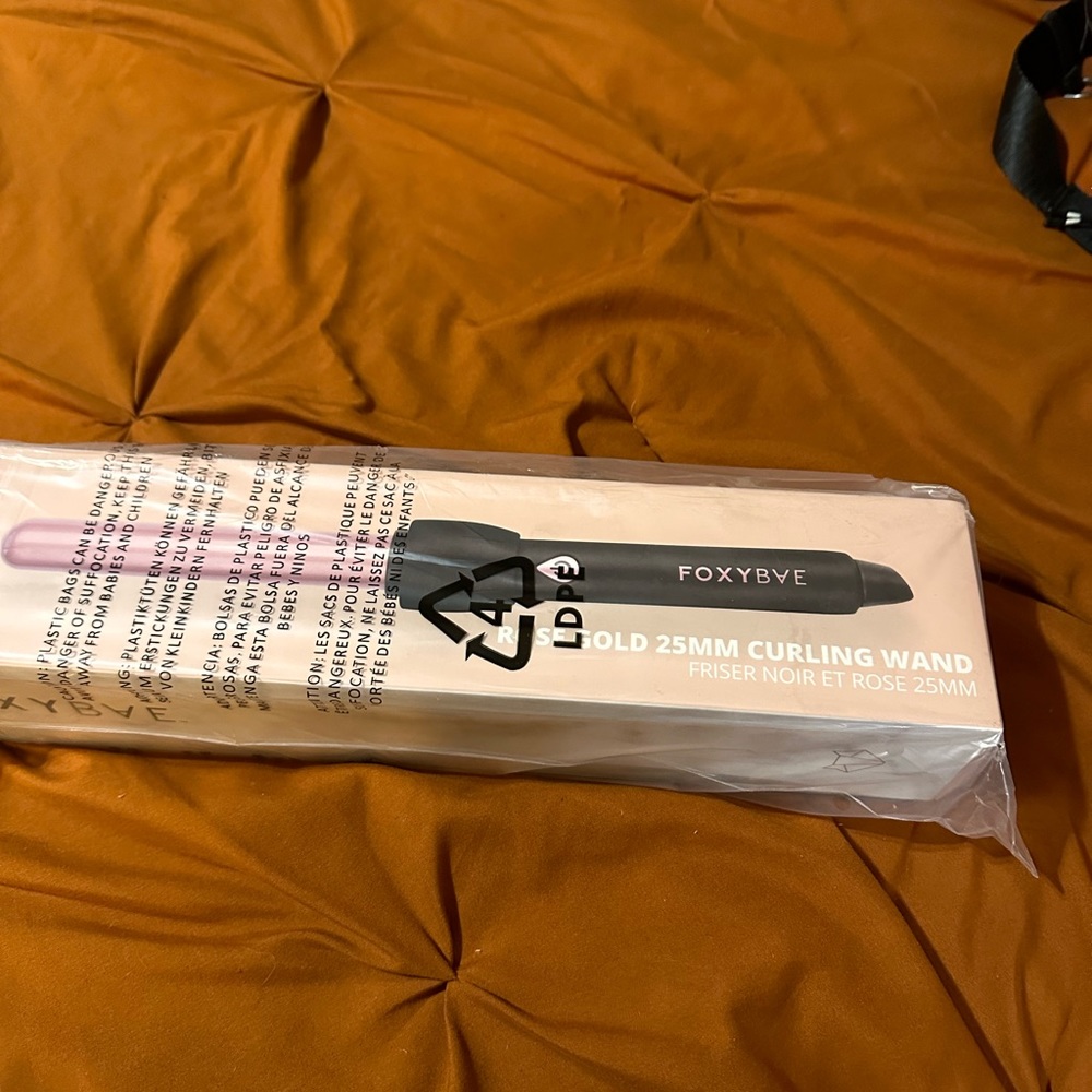 Brand new, in box with plastic wrap, foxy bae curling wand